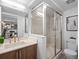 Contemporary bathroom featuring a glass-enclosed shower, vanity, and modern fixtures at 1495 Vrain St # 214, Denver, CO 80204