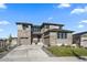 Two-story home with stone accents and a landscaped yard at 7125 S Yantley Way, Aurora, CO 80016