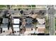 An aerial view displays rooftops on a tree-lined street with a bike path and vehicular traffic at 2850 Lowell Blvd, Denver, CO 80211