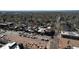 Aerial view of a commercial section of the neighborhood showing tree-lined streets and parking at 2850 Lowell Blvd, Denver, CO 80211