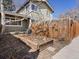 Charming backyard featuring a quaint garden bed, wood fence and partial view of the home's exterior at 2850 Lowell Blvd, Denver, CO 80211