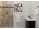Bathroom featuring a tiled glass door shower and modern vanity with attractive fixtures and decor at 2850 Lowell Blvd, Denver, CO 80211
