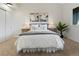 Bedroom features neutral decor, carpeted floors, and a large window with view to the outdoors at 2850 Lowell Blvd, Denver, CO 80211