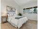 Bright bedroom features neutral decor, carpeted floors and a window with view to the outdoors at 2850 Lowell Blvd, Denver, CO 80211