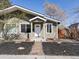 Charming home featuring a manicured front yard, quaint walkway, and stylish front door at 2850 Lowell Blvd, Denver, CO 80211