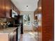Modern kitchen featuring dark wood cabinetry, granite countertops, and stainless steel appliances at 2850 Lowell Blvd, Denver, CO 80211