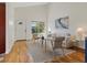 Cozy living room with vaulted ceilings and a view through the front window at 2850 Lowell Blvd, Denver, CO 80211
