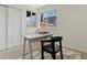 Home office features neutral walls, modern desk and chair, with natural light from the two windows at 2850 Lowell Blvd, Denver, CO 80211
