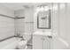 Clean bathroom with a shower/tub and white vanity at 8704 Garrison Ct, Arvada, CO 80005