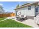 Charming backyard retreat with patio seating, lush grass, and a fenced perimeter at 4504 N Clay St, Denver, CO 80211
