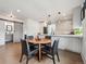 Contemporary kitchen open layout features stylish island, granite countertops and a sliding barn door at 4504 N Clay St, Denver, CO 80211