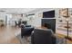Cozy living room featuring stylish decor, hardwood floors, and seamless transition to kitchen at 4504 N Clay St, Denver, CO 80211