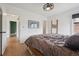 Another view of the main bedroom featuring wood floors and easy access to additional rooms at 4504 N Clay St, Denver, CO 80211