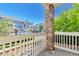 Balcony view of residential neighborhood featuring brick column and white wood railing at 9429 Ashbury Cir # 101, Parker, CO 80134