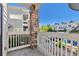Balcony view of residential area featuring brick column and white wood railing at 9429 Ashbury Cir # 101, Parker, CO 80134