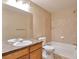 Functional bathroom featuring a tub and shower combination with tile surround at 9429 Ashbury Cir # 101, Parker, CO 80134