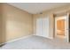 Spacious carpeted bedroom with ensuite bathroom and large closet at 9429 Ashbury Cir # 101, Parker, CO 80134