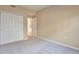 Carpeted bedroom with ample closet space and natural light at 9429 Ashbury Cir # 101, Parker, CO 80134