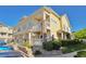 Exterior view highlighting a two-story building with manicured landscaping and accessible entrance at 9429 Ashbury Cir # 101, Parker, CO 80134