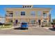 Attractive exterior featuring a two-story facade with covered front porches and dedicated parking spaces at 9429 Ashbury Cir # 101, Parker, CO 80134