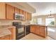 Efficient kitchen layout includes modern appliances and ample counter space at 9429 Ashbury Cir # 101, Parker, CO 80134