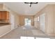Bright living room showcasing a sliding door to balcony, neutral walls, and plush carpet flooring at 9429 Ashbury Cir # 101, Parker, CO 80134