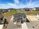 New construction home featuring a modern grey exterior, gravel landscaping, and a two-car garage at 1694 Fox Trotter Pt, Castle Rock, CO 80104