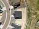 Aerial view of modern home showcasing lot size, roof, and neighborhood street layout at 1694 Fox Trotter Pt, Castle Rock, CO 80104