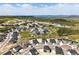 Expansive aerial view of a new community showcasing homes nestled in a scenic landscape with mountain views at 1694 Fox Trotter Pt, Castle Rock, CO 80104
