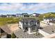 Charming new construction home featuring a well-manicured front yard and a two-car garage at 1694 Fox Trotter Pt, Castle Rock, CO 80104