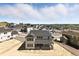 New construction two-story home with rear covered porch and neighborhood views at 1694 Fox Trotter Pt, Castle Rock, CO 80104