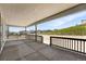 Large covered back porch perfect for outdoor relaxation with beautiful neighborhood views at 1694 Fox Trotter Pt, Castle Rock, CO 80104
