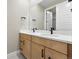 Bathroom with double sink vanity, quartz countertop, and black fixtures at 1694 Fox Trotter Pt, Castle Rock, CO 80104