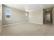 Spacious bedroom with two windows providing plenty of natural light and neutral carpet at 1694 Fox Trotter Pt, Castle Rock, CO 80104