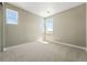 Bright bedroom with neutral carpet and multiple windows allowing for natural light at 1694 Fox Trotter Pt, Castle Rock, CO 80104