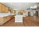 Large kitchen with stainless hood, center island and lots of natural light at 1694 Fox Trotter Pt, Castle Rock, CO 80104