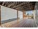 Outdoor deck featuring wood-like flooring and a covered pergola at 3090 S Telluride St, Aurora, CO 80013