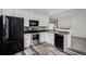 Modern kitchen features stainless steel appliances, white cabinets, and mosaic backsplash for a sleek design at 3090 S Telluride St, Aurora, CO 80013