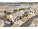 Scenic aerial view of a house with a nearby lake, highlighting its location and neighborhood features at 1520 Symphony Hts, Monument, CO 80132