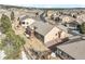 High-angle view of a house with a backyard patio, emphasizing neighborhood planning and landscape at 1520 Symphony Hts, Monument, CO 80132