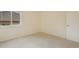 This bedroom features neutral carpeting and a large window for natural light at 1520 Symphony Hts, Monument, CO 80132