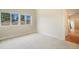 Spacious bedroom with scenic views from bright windows and hardwood floors just outside the entry door at 1520 Symphony Hts, Monument, CO 80132