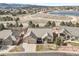 Beautiful ranch-style home with well-manicured landscaping and a three car garage in a desirable location near a lake at 1520 Symphony Hts, Monument, CO 80132