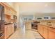 Spacious kitchen with granite countertops, stainless steel appliances, and tile flooring at 1520 Symphony Hts, Monument, CO 80132