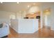 Open kitchen with light wood cabinets and modern appliances at 1520 Symphony Hts, Monument, CO 80132