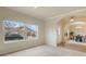 Spacious living area with large window, light carpet, and views of dining space, promoting an open and airy feel at 1520 Symphony Hts, Monument, CO 80132