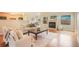 Inviting living room features a fireplace, hardwood floors and neutral decor at 1520 Symphony Hts, Monument, CO 80132