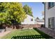 Relaxing backyard with hammock, raised garden beds, and wooden fence at 2719 S Truckee St, Aurora, CO 80013