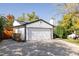 Attached two-car garage with solar panels and new paint at 2719 S Truckee St, Aurora, CO 80013