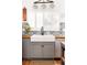 Kitchen with a large white farmhouse sink and stainless steel dishwasher at 2719 S Truckee St, Aurora, CO 80013